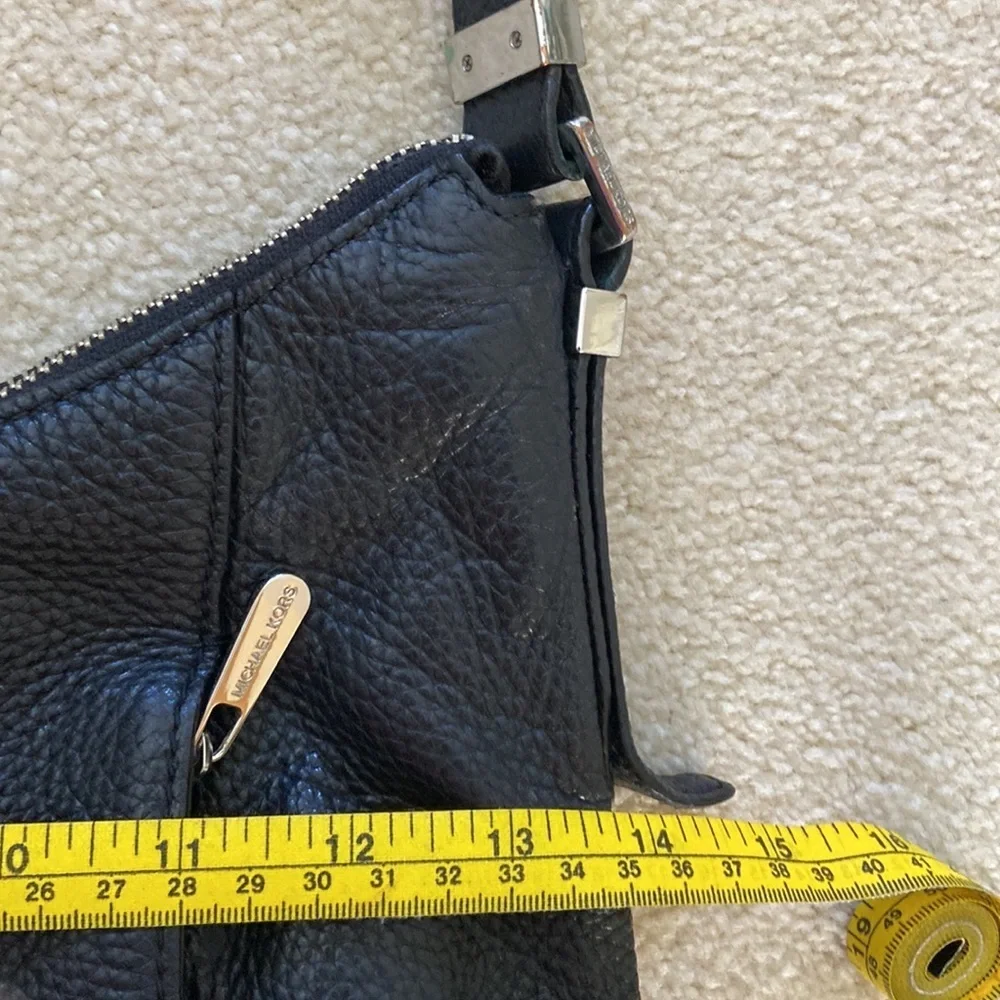 Michael Kors black leather shoulder bag, silver hardware logo on zipper, clean